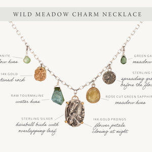 Nature-inspired Wild Meadow Charm Necklace in sterling silver and 14k gold with wildflower botanical textures, green sapphire, tourmaline, kyanite and green garnet gemstones.