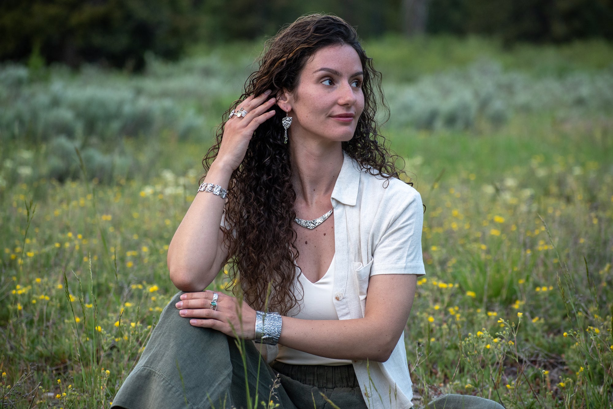 Wild Meadow Triangle Earrings in sterling silver with sagebrush, goldenrod, lupine and wild grass botanical textures, dangling silver chains and green diamond, kyanite and green garnet gemstones.