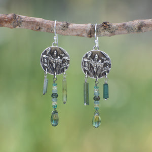 Round Wild Meadow Earrings in sterling silver with Spreading Groundsmoke botanical textures and dangling tourmaline, aquamarine, green rutile, emerald, green garnet and kyanite gemstones.