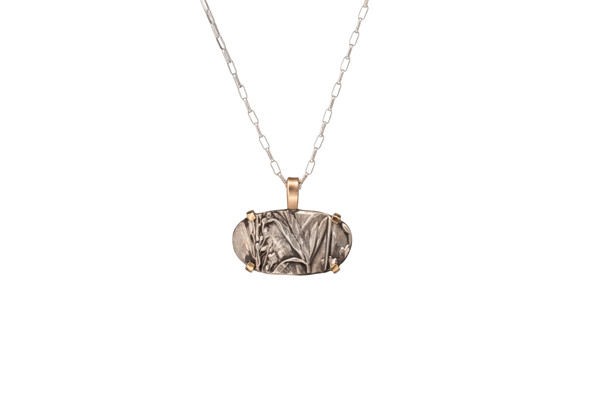Nature-inspired Horizontal Wild Meadow Necklace in oxidized sterling silver and 14k gold with wildflower and botanical textures from lupine leaves and late-summer sagebrush buds.