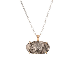 Nature-inspired Horizontal Wild Meadow Necklace in oxidized sterling silver and 14k gold with wildflower and botanical textures from lupine leaves and late-summer sagebrush buds.