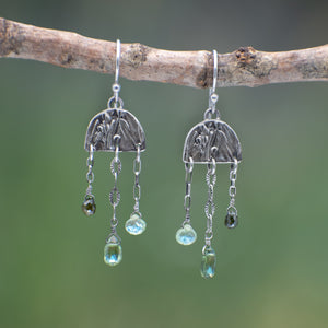 Wild Meadow Rain Earrings in sterling silver with late-summer sage botanical textures, dangling silver chains and green diamond, kyanite and green garnet gemstones.