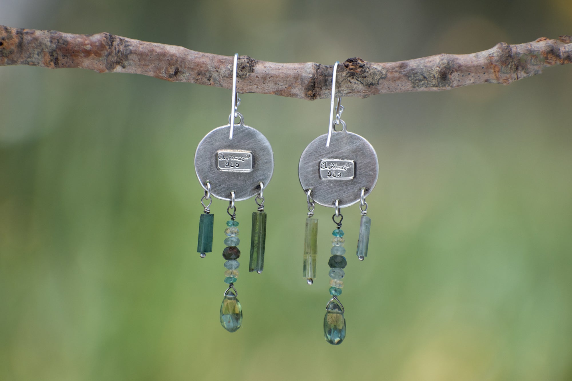 Round Wild Meadow Earrings in sterling silver with Spreading Groundsmoke botanical textures and dangling tourmaline, aquamarine, green rutile, emerald, green garnet and kyanite gemstones.