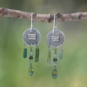 Round Wild Meadow Earrings in sterling silver with Spreading Groundsmoke botanical textures and dangling tourmaline, aquamarine, green rutile, emerald, green garnet and kyanite gemstones.