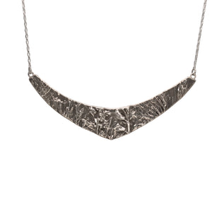 Nature-inspired Wild Meadow Texture Necklace in sterling silver with layered wildflower and botanical textures from lupine petals, goldenrod, sage leaves and wild grasses.
